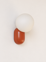 red capsule and opal globe wall light