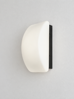 Curved white glass and black wall sconce, front view