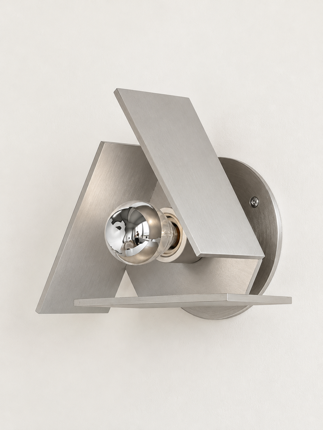 Brushed silver triangular wall sconce half-chrome bulb unlit