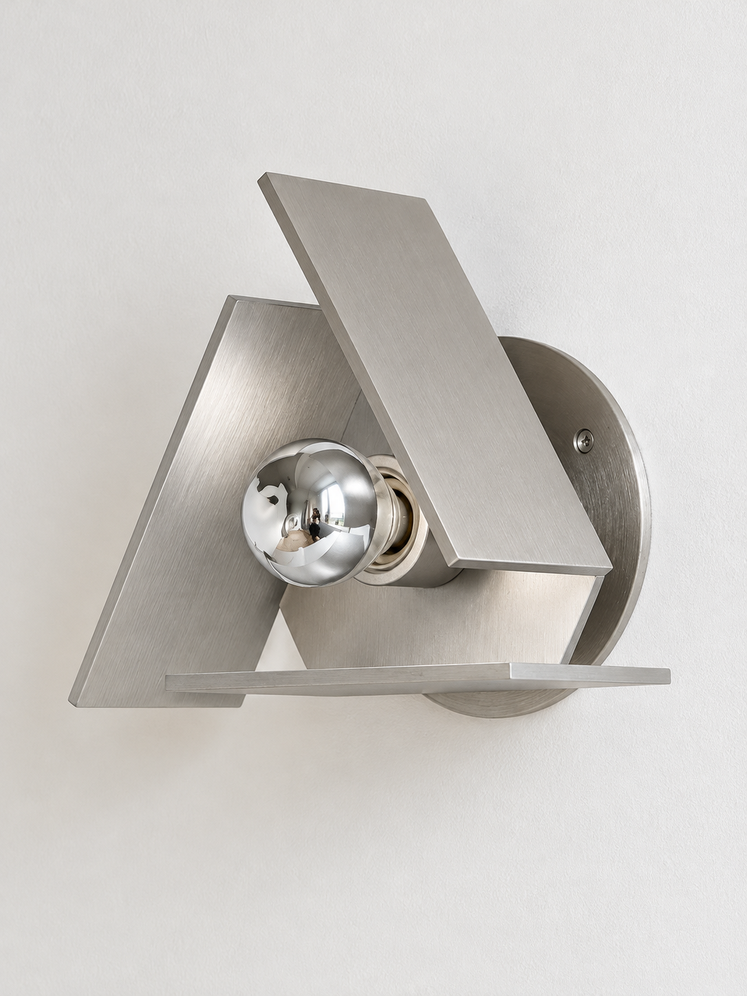 Brushed silver triangular wall sconce half-chrome bulb unlit