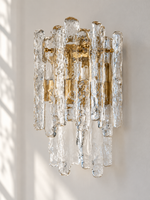 Clear textured ice glass wall sconce with copper-tone frame, side detail