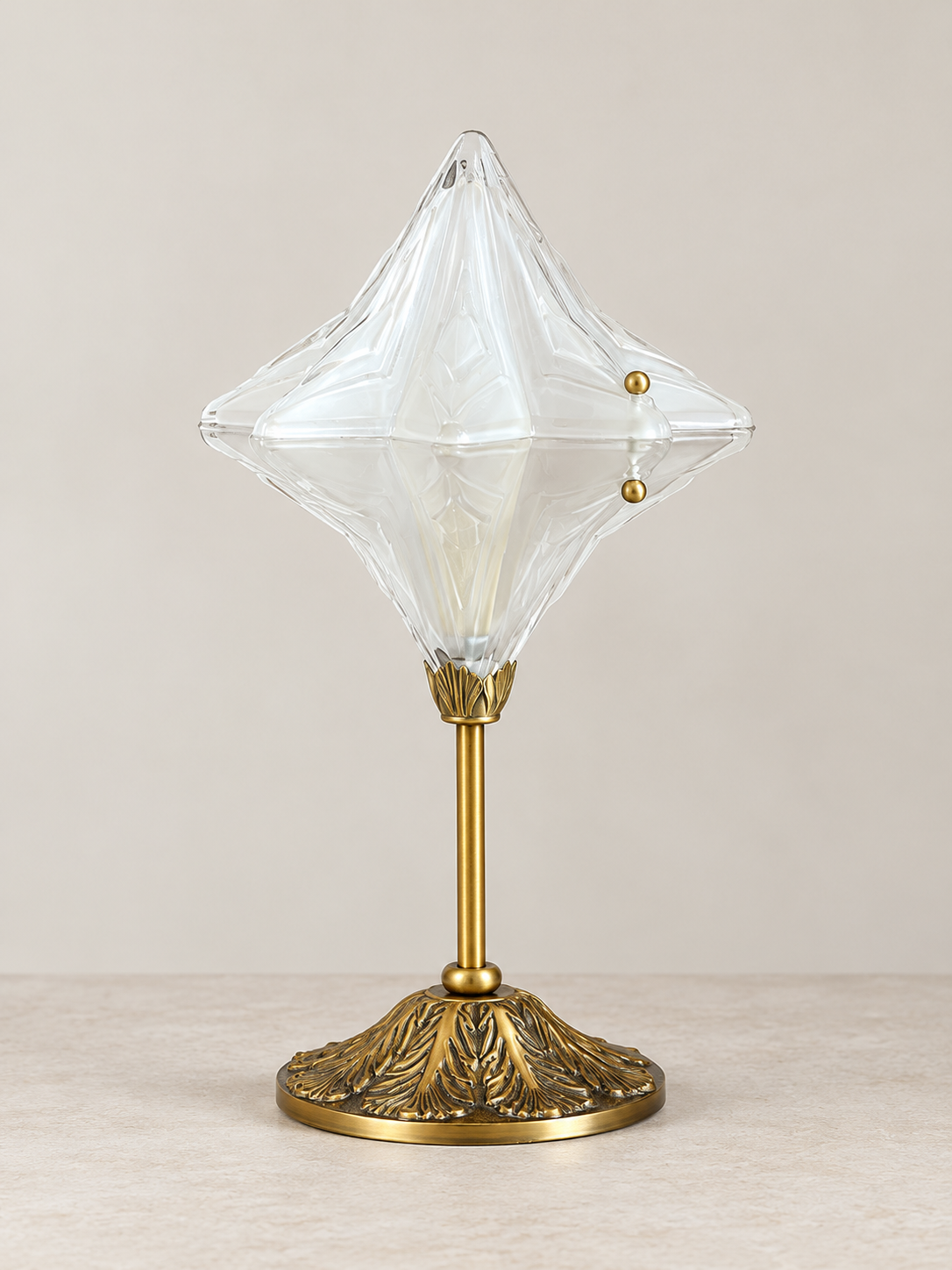 Sculpted glass star table lamp brass
