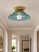 Ribbed flared glass flush mount ceiling light, blue glass hallway view
