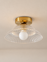 Ribbed flared glass flush mount ceiling light, clear glass front view