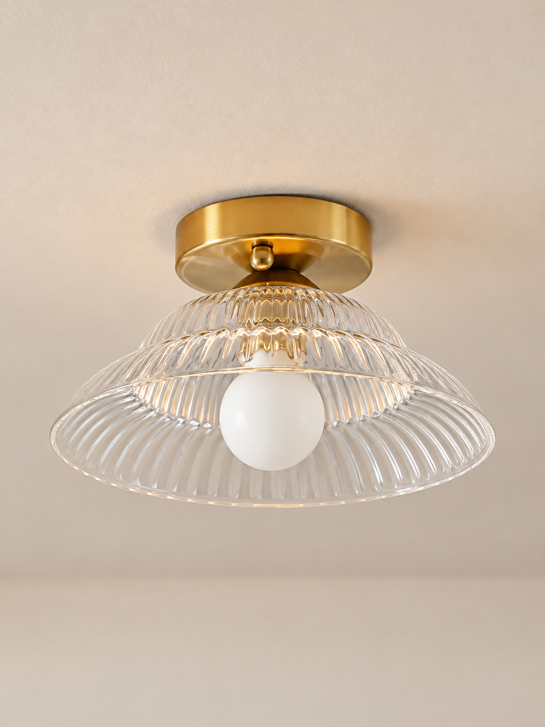 Ribbed flared glass flush mount ceiling light, clear glass front view