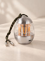 Capsule Glow Portable Lamp switched off, showing chrome aluminum and clear acrylic