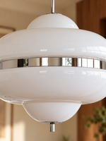 Close detail of white glass and reflective chrome band on the MD4797 pendant