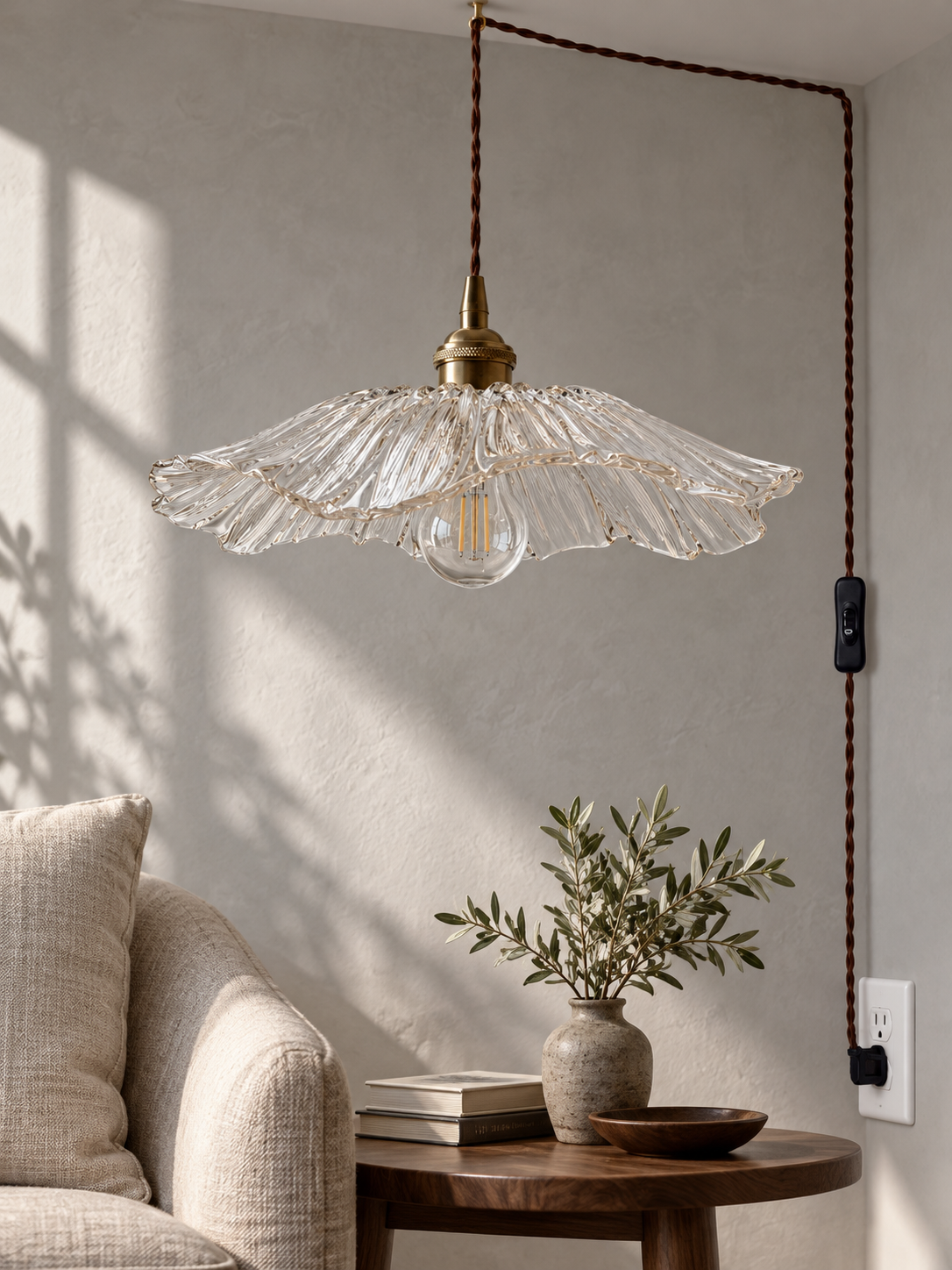 Clear Flower Glass Pendant Light in a reading nook with cord, inline switch and US plug