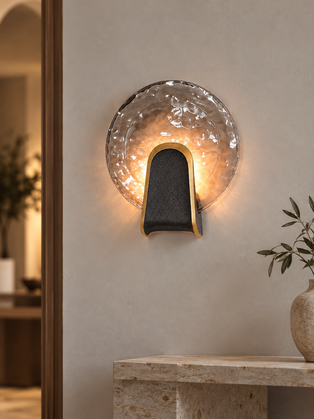 Halo Crest round smoke gray textured glass LED wall light in a hallway