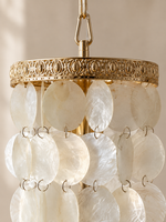Natural ivory shell discs and decorative gold-tone iron rim detail
