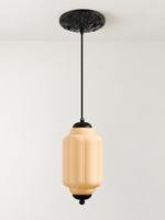 Melon ribbed glass pendant with black hardware and embossed canopy, shown switched off in daylight