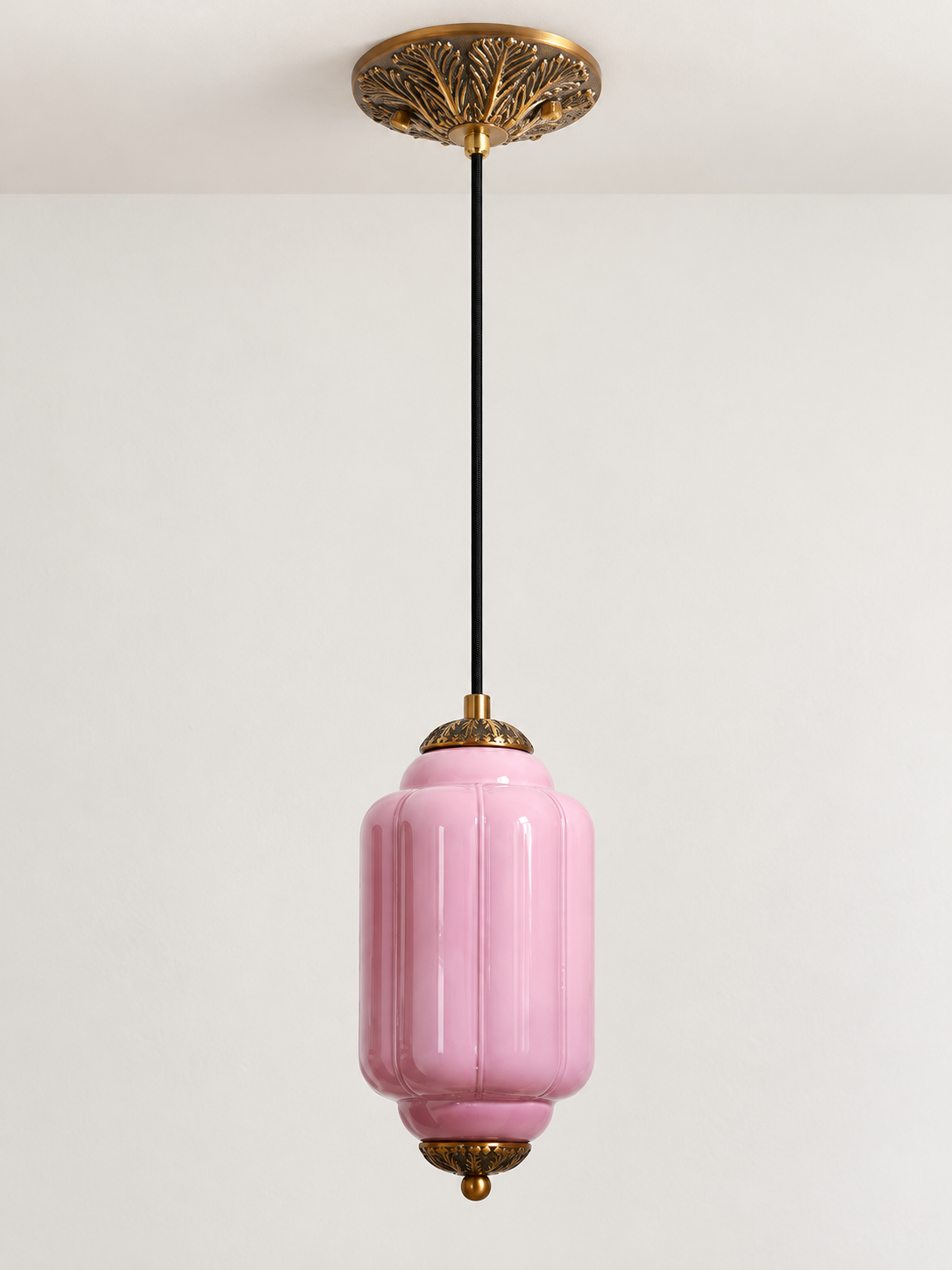 Purple ribbed glass pendant with copper-tone hardware and embossed canopy, shown switched off in daylight
