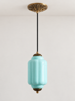 Blue ribbed glass pendant with copper-tone hardware and embossed canopy, shown switched off in daylight