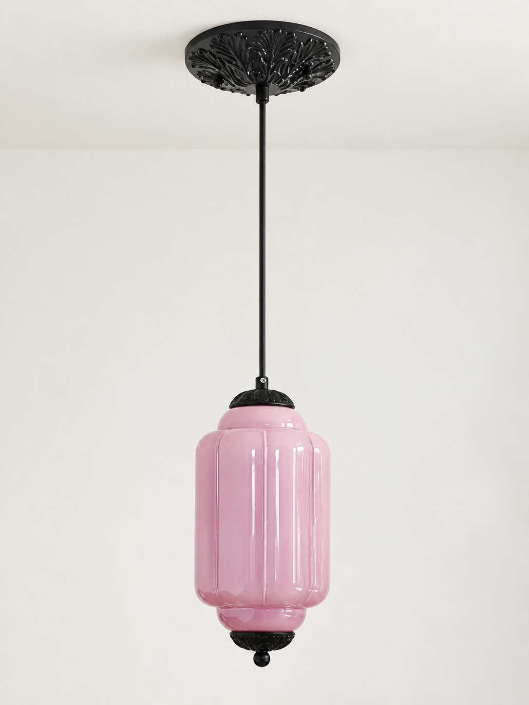 Purple ribbed glass pendant with black hardware and embossed canopy, shown switched off in daylight