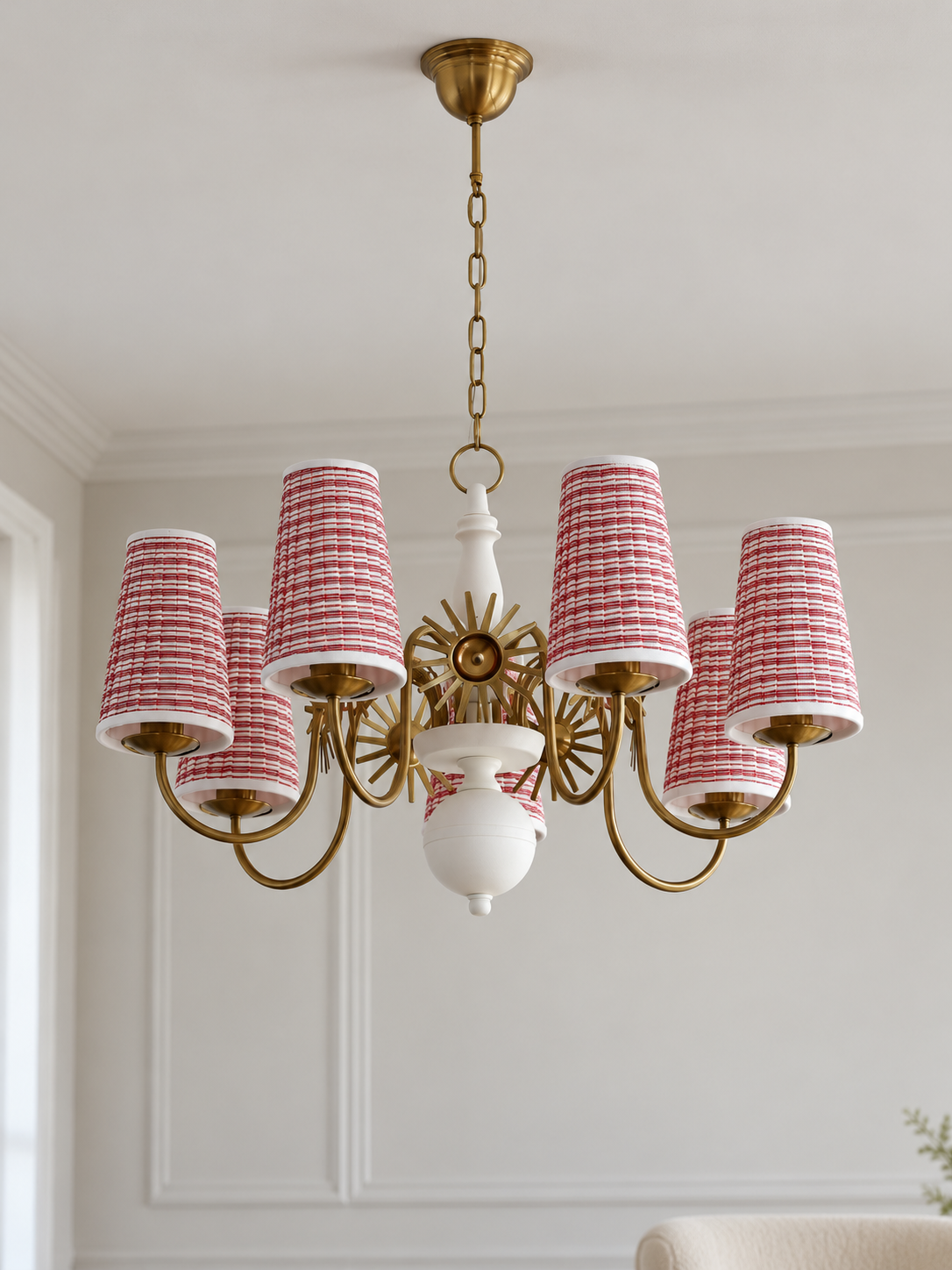Copper-tone and white 7-light chandelier with red-and-white striped fabric shades, shown switched off