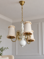 Copper-tone and white 3-light chandelier with cream pleated fabric shades and ruffled trim, shown switched off