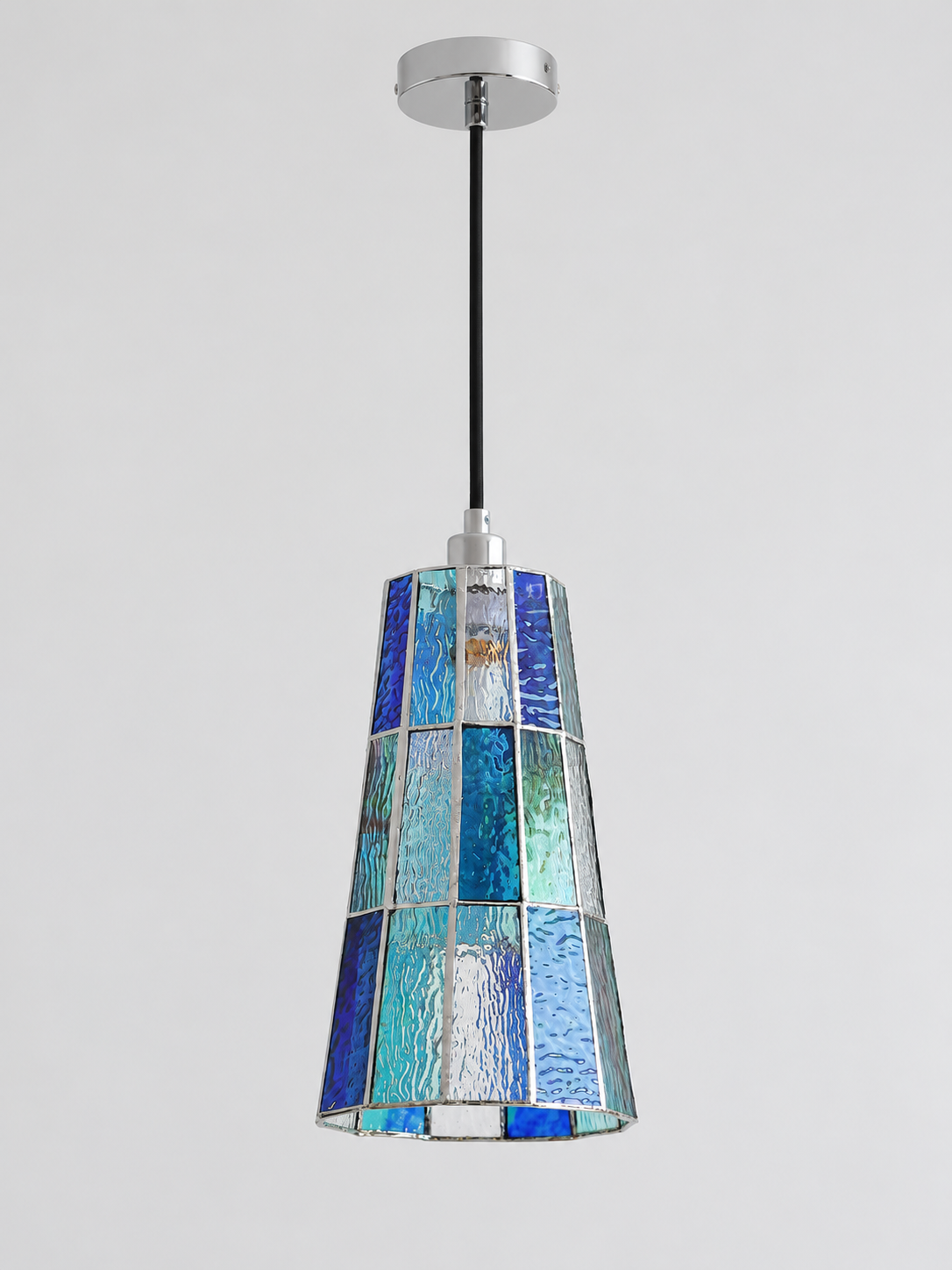 Blue tall tapered mosaic glass pendant with silver-tone canopy and black cord, shown switched off