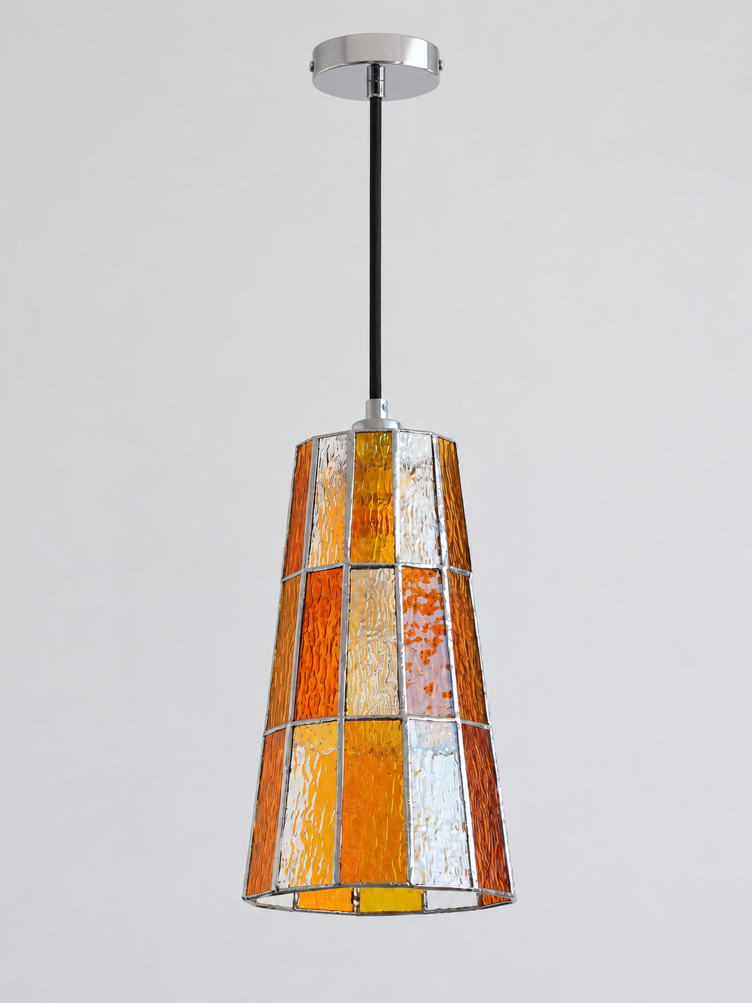 Orange tall tapered mosaic glass pendant with silver-tone canopy and black cord, shown switched off