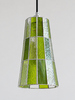Close view of the green textured mosaic glass shade with silver-tone seams, shown switched off