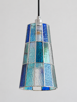 Close view of the blue textured mosaic glass shade with silver-tone seams, shown switched off