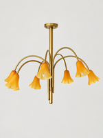 Matte Orange 7-light flower glass chandelier with copper-tone arched arms, shown switched off.