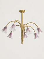 Purple 7-light flower glass chandelier with copper-tone arched arms, shown switched off.