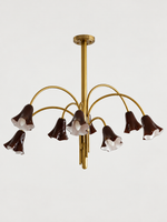 Coffee 8-light flower glass chandelier with copper-tone arched arms, shown switched off.