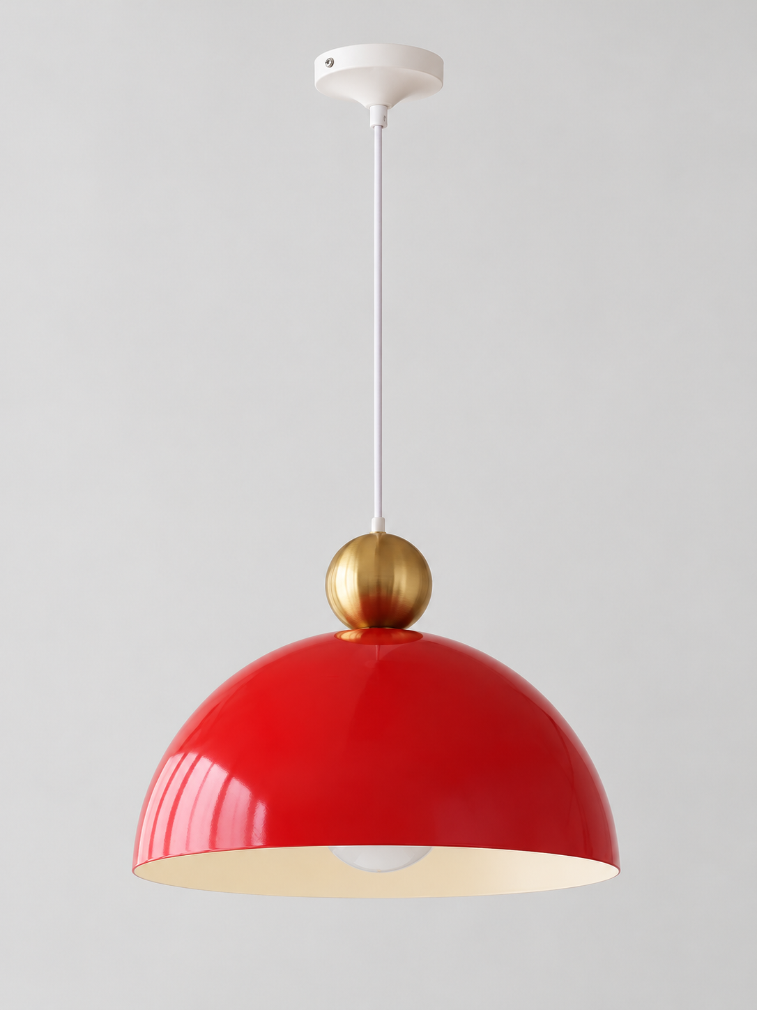 Pomegranate Red 35 cm metal dome pendant with a gold-tone orb, white cord and canopy, shown switched off