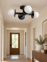 Black Cross Opal Four-Globe Ceiling Light in a hallway