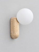 Travertine pill wall light with opal glass globe — front off v1