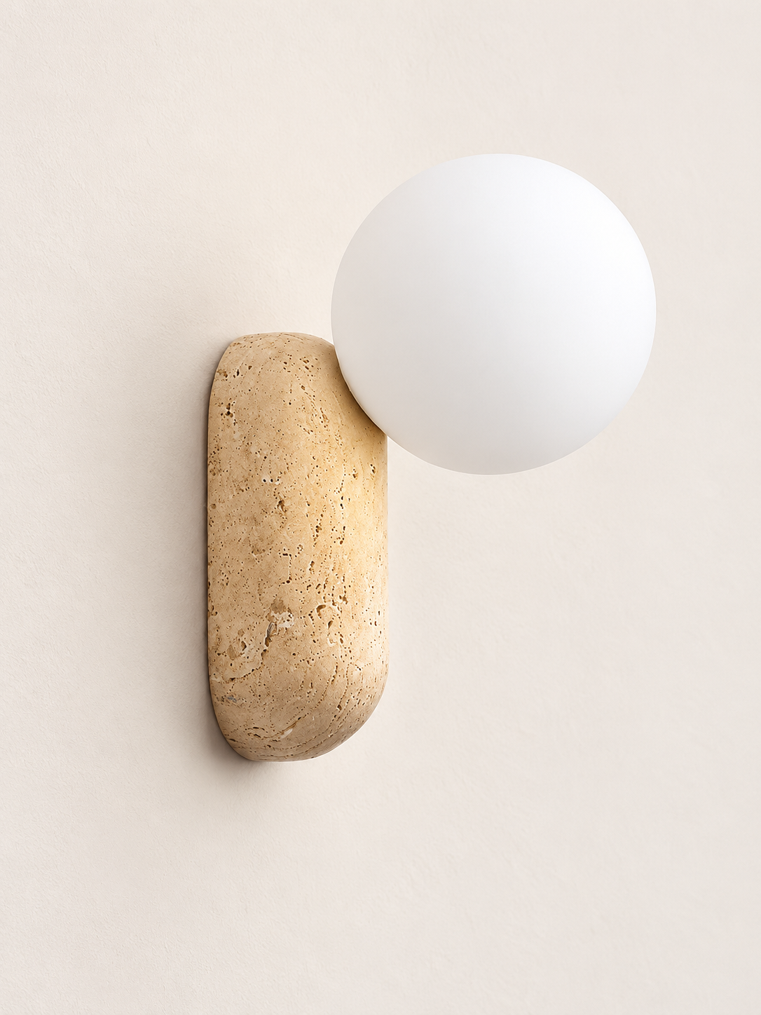 Travertine pill wall light with opal glass globe — hero off v1
