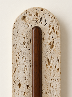 Perforated travertine LED wall light with central wood — detail