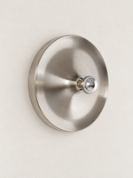 Brushed silver smooth reflector wall light with mirror-top bulb, unlit