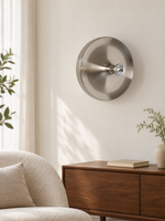 Silver reflector wall light in an interior