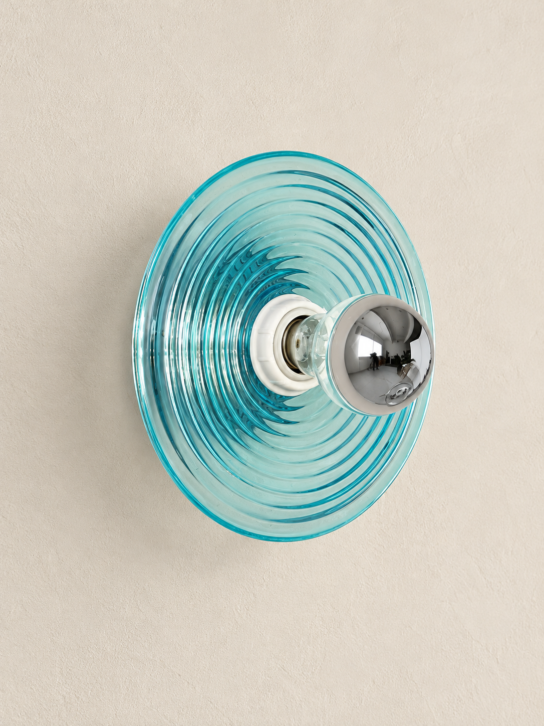 Blue concentric ripple glass hardwired wall light, unlit
