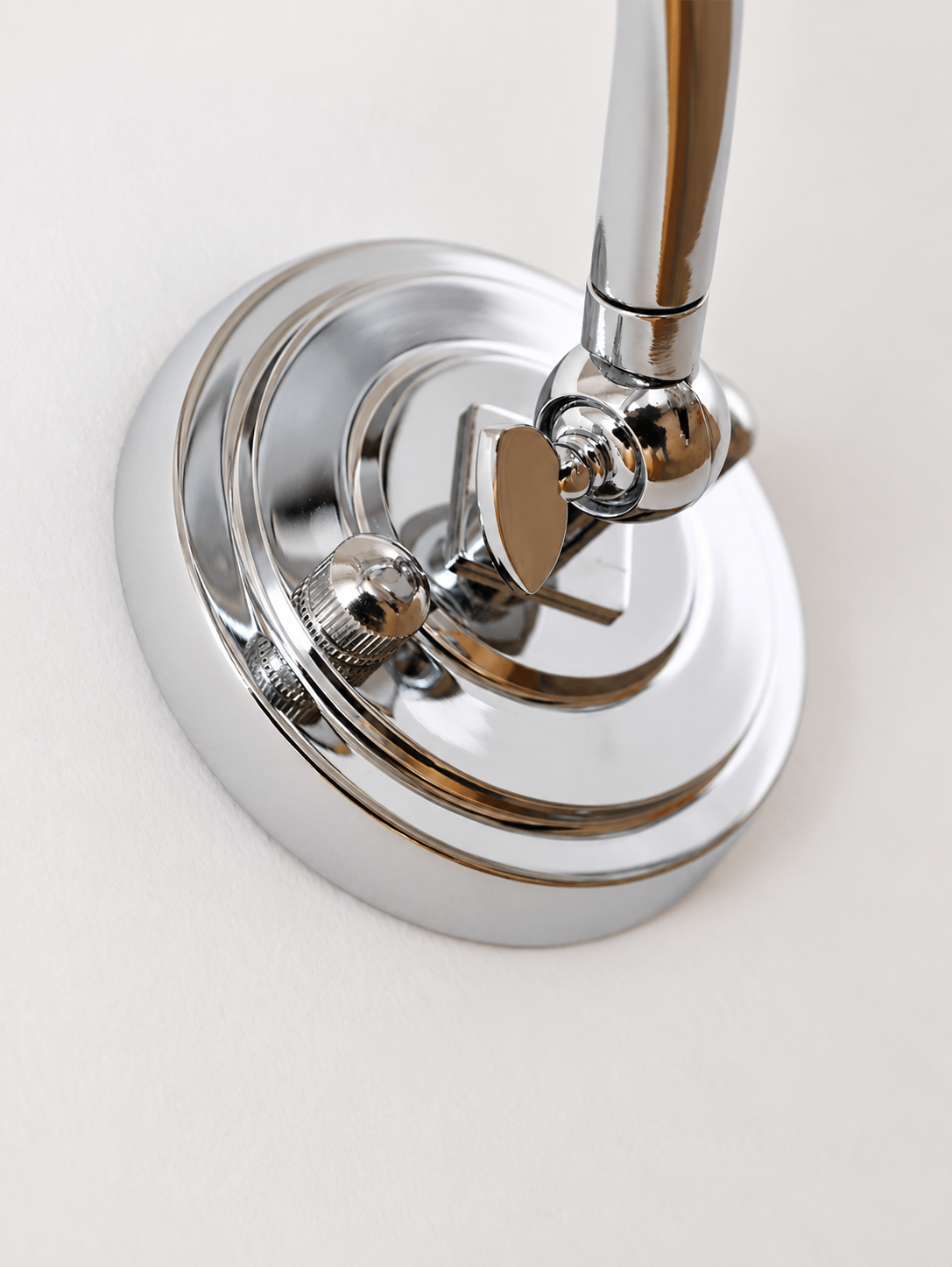 Chrome wall-arm adjustment joint detail
