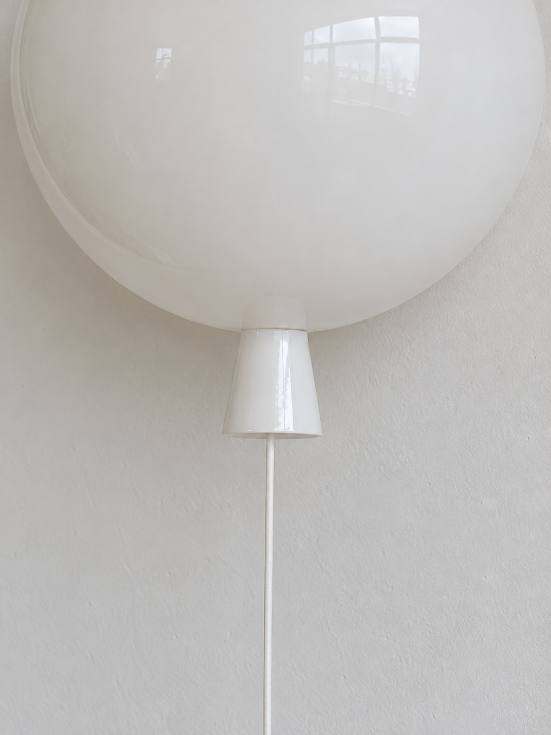 Ivory glass tapered neck and hanging cord detail