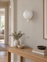 Ivory balloon wall light in a hallway