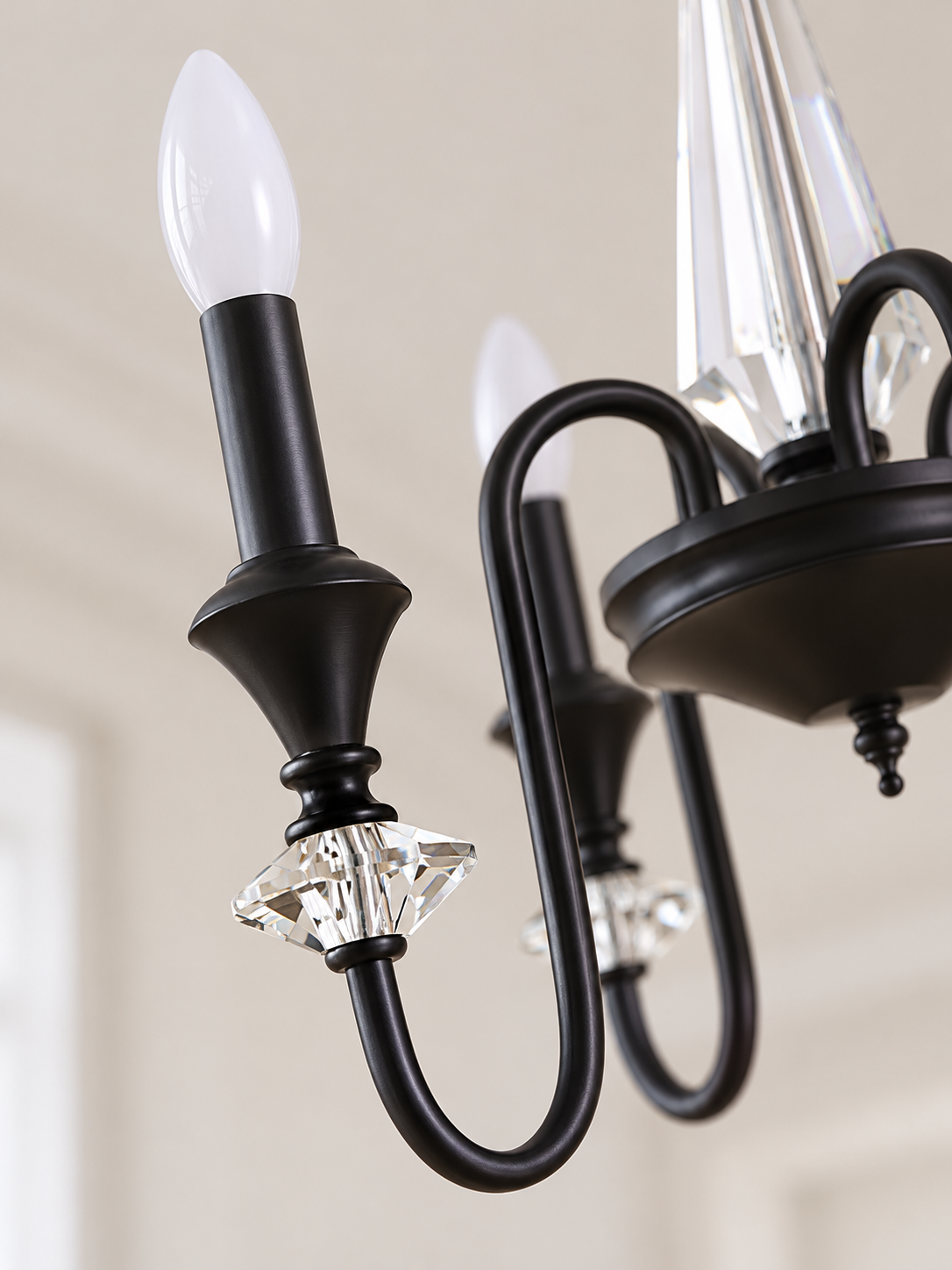 Black iron and crystal chandelier detail
