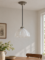 Antique Silver pendant with translucent patterned glass dome, shown unlit, daylight dining-room setting