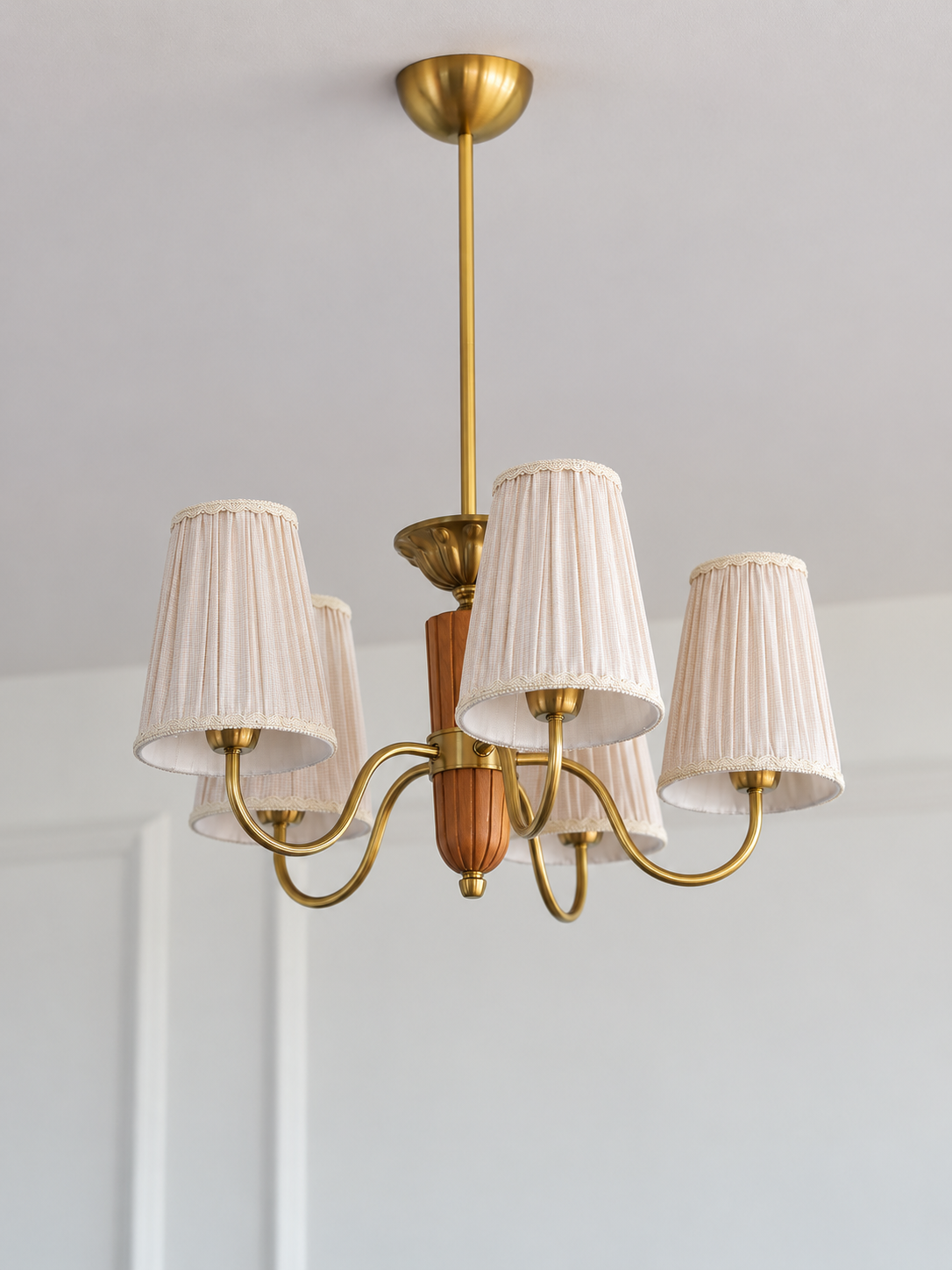5-light round chandelier, full product view, unlit pleated fabric shades and copper-color hardware