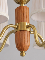 5-light chandelier faceted wood and metal joint detail, unlit pleated fabric shades and copper-color hardware