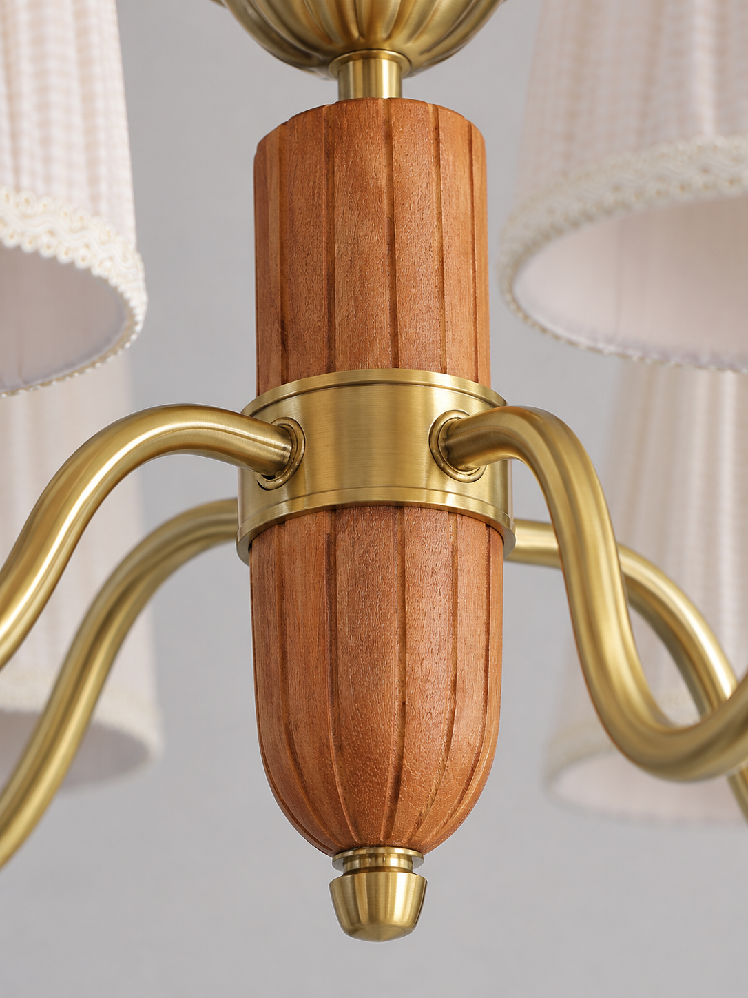 5-light chandelier faceted wood and metal joint detail, unlit pleated fabric shades and copper-color hardware
