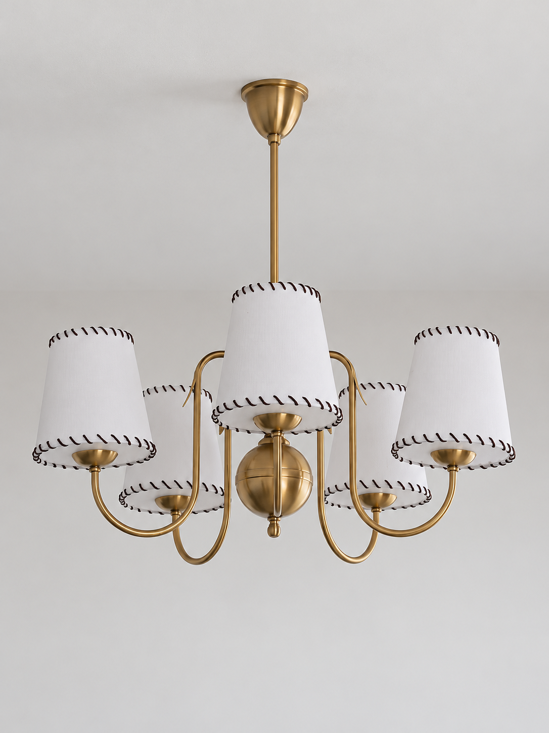 Copper-tone chandelier with 5 white stitched fabric shades, shown unlit, product view
