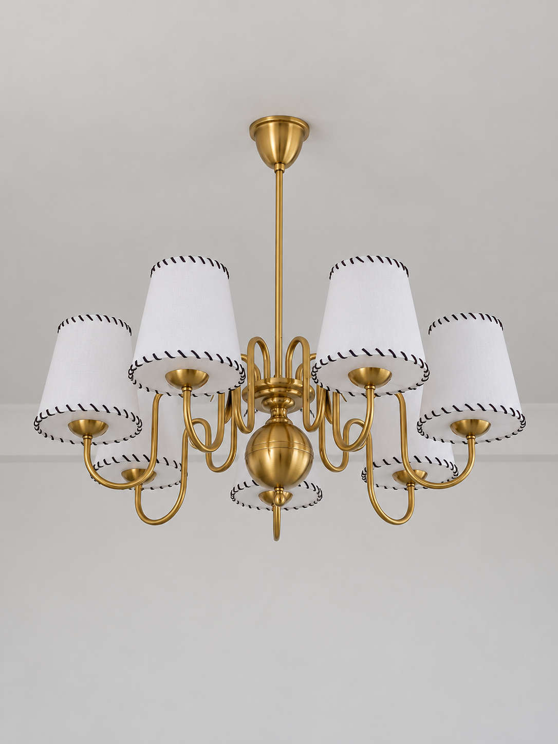 Copper-tone chandelier with 7 white stitched fabric shades, shown unlit, product view