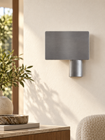 Brushed aluminum offset shield wall sconce, left, lifestyle hero