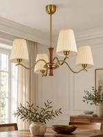 Pleated cream shade scroll chandelier, 4-light round, lifestyle hero
