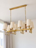 Pleated cream shade scroll chandelier, 8-light linear