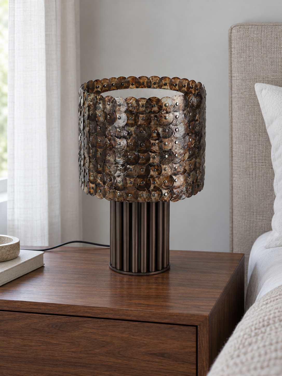Coffee shell mosaic table lamp switched off, bedside lifestyle view
