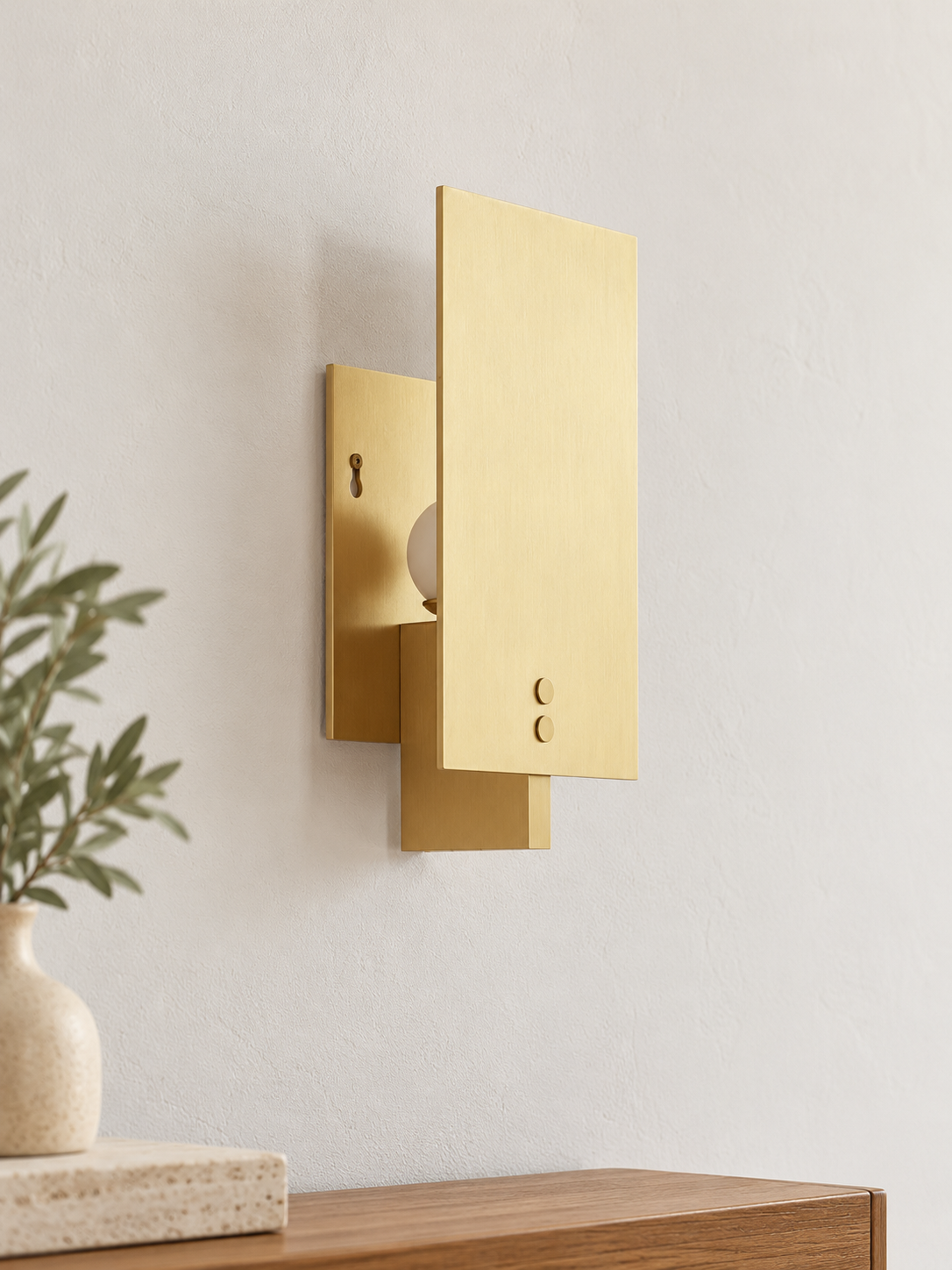 Panel Glow wall sconce in Copper Tone, unlit on an ivory wall above an oak console